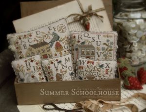 Summer Schoolhouse Entire Series - An old fashioned school box houses the collection.